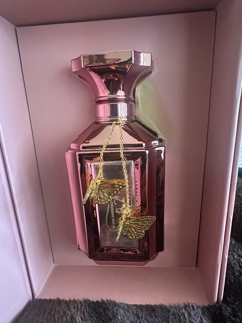 New- Aroma 360 perfume by Lisa Hochstein Rose pink bottle.